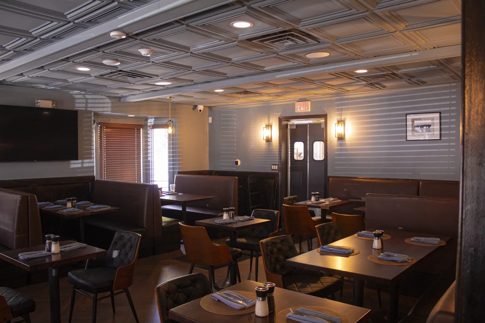 Booth seating and wall sconces in the private dining room